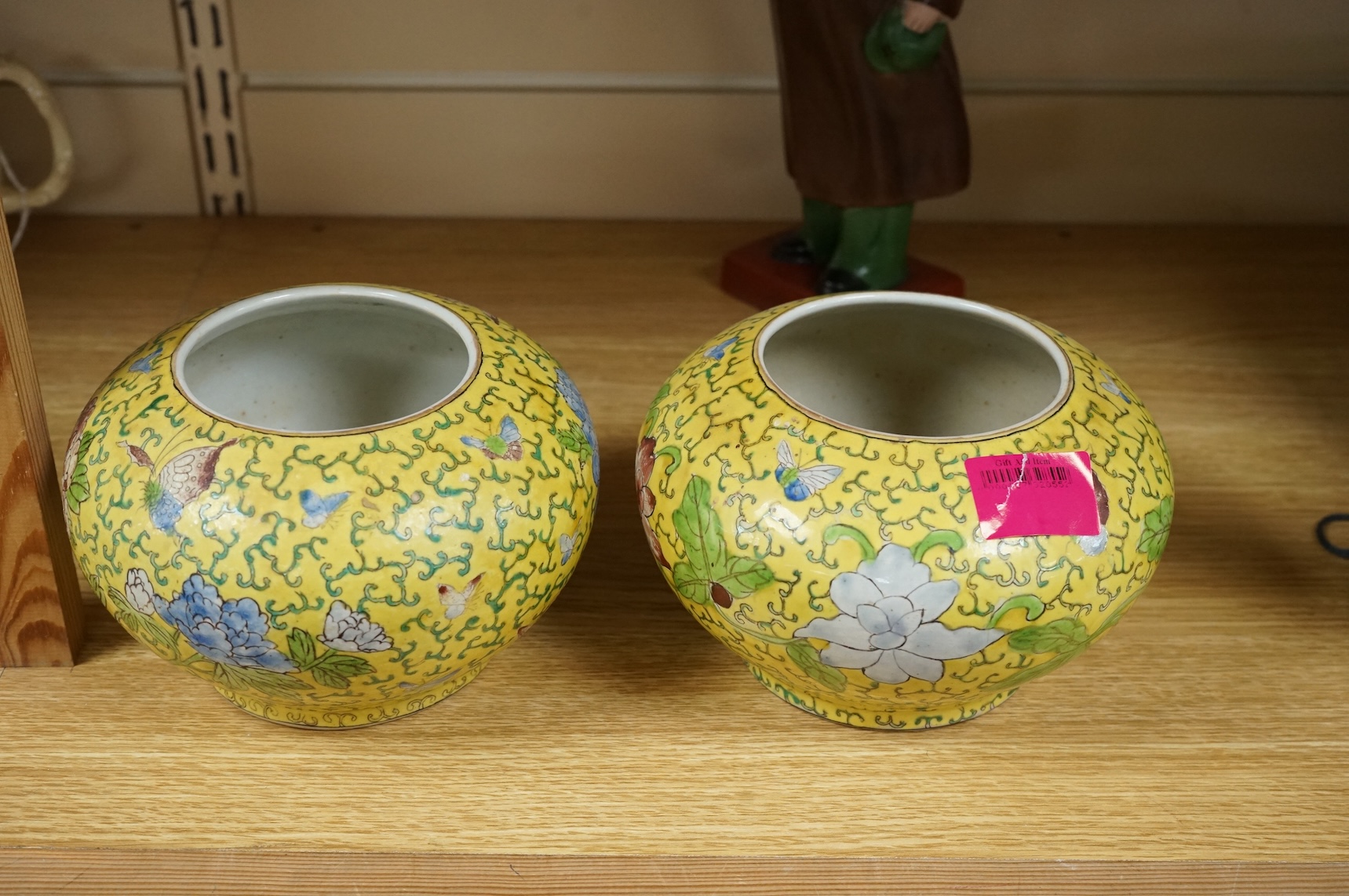 A Chairman Mao porcelain figure and a pair of Chinese yellow ground bowls decorated with flowers and insects, largest 30cm high